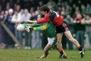 5 February 2006; Ger Robinson, Meath, in action against Damien Rafferty, Down. Allianz National Football League, Division 1B, Round 1, Down v Meath, St. Patrick's Park, Newcastle, Co. Down. Picture credit: Brendan Moran / SPORTSFILE