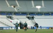 10 February 2006; Ireland out-half Ronan O'Gara practices his kicking watched by team-mate David Humphreys and kicking coach Mark Tainton. Ireland Kicking Practice, Stade de France, Paris, France. Picture credit; Brendan Moran / SPORTSFILE