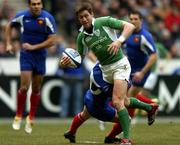 11 February 2006; Ronan O'Gara, Ireland, is tackled by Jean Baptiste Elissalde, France. RBS 6 Nations 2006, France v Ireland, Stade de France, Paris, France. Picture credit; Brendan Moran / SPORTSFILE