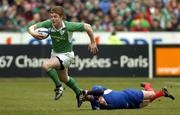 11 February 2006; Brian O'Driscoll, Ireland, is tackled by Jean-Baptiste Elissalde, France. RBS 6 Nations 2006, France v Ireland, Stade de France, Paris, France. Picture credit; Matt Browne / SPORTSFILE