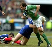11 February 2006; Geordan Murphy, Ireland, is tackled by Remy Matrin, France. RBS 6 Nations 2006, France v Ireland, Stade de France, Paris, France. Picture credit; Brendan Moran / SPORTSFILE
