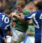 11 February 2006; Paul O'Connell, Ireland, is tackled by Frederic Michalak,10, and Fabien Pelous, France. RBS 6 Nations 2006, France v Ireland, Stade de France, Paris, France. Picture credit; Matt Browne / SPORTSFILE
