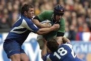 11 February 2006; Denis Leamy, Ireland, is tackled by Sylvain Marconnet,left, and Lionel Nallet, France. RBS 6 Nations 2006, France v Ireland, Stade de France, Paris, France. Picture credit; Matt Browne / SPORTSFILE