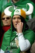 11 February 2006; An Irish fan watches a nailbiting finish to the game. RBS 6 Nations 2006, France v Ireland, Stade de France, Paris, France. Picture credit; Brendan Moran / SPORTSFILE