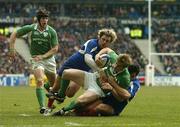 11 February 2006; Andrew Trimble, Ireland, is stopped short of the try line by Cedric Haymans and Ludovic Valbon, right, France, late in the game. RBS 6 Nations 2006, France v Ireland, Stade de France, Paris, France. Picture credit; Brendan Moran / SPORTSFILE