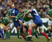 11 February 2006; David Wallace, Ireland, is tackled by Frederic Michalak and Jerome Thion, France. RBS 6 Nations 2006, France v Ireland, Stade de France, Paris, France. Picture credit; Brendan Moran / SPORTSFILE
