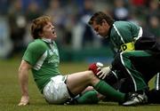 11 February 2006; Ireland captain Brian O'Driscoll is attended to by team physio Cameron Steele. RBS 6 Nations 2006, France v Ireland, Stade de France, Paris, France. Picture credit; Brendan Moran / SPORTSFILE