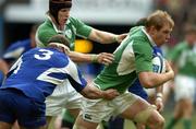 11 February 2006; Paul O'Connell, Ireland, is tackled by Pieter de Villiers, France. RBS 6 Nations 2006, France v Ireland, Stade de France, Paris, France. Picture credit; Brendan Moran / SPORTSFILE
