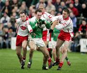 Presspics Sunday 12th February 2005 Fermanaghs James Sherry against Tyrones Brian Meenan, Kevin Hughes and Cormac Mc Ginley ; Fermanagh V Tyrone Allianz National League at Brewester Park Enniskillen, Co Fermanagh .Picture Credit-Oliver Mc Veigh