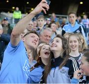 27 April 2014; Dublin's Paul Flynn poses with girls from the Na Fianna GAA Club for a 'selfie' after the game. Allianz Football League Division 1 Final, Dublin v Derry, Croke Park, Dublin. Picture credit: Ray McManus / SPORTSFILE