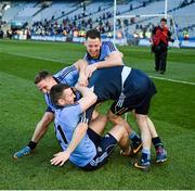27 April 2014; Philly McMahon, Davy Byrne and Sean George combine to topple Dublin captain Stephen Cluxton after the game. Allianz Football League Division 1 Final, Dublin v Derry, Croke Park, Dublin. Picture credit: Ray McManus / SPORTSFILE