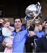 27 April 2014; Michael Darragh MacAuley, Dublin, celebrates by lifting the cup at the end of the game with his niece Rebecca Sheridan, age 3. Allianz Football League Division 1 Final, Dublin v Derry, Croke Park, Dublin. Picture credit: David Maher / SPORTSFILE
