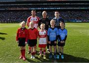 27 April 2014; Referee Cormac Reilly, Derry captain Mark Lynch, Dublin captain Stephen Cluxton, with 'Young Whistlers' Aishling Cullen, Whitehall, Claire Finn, Whitehall, the Derry Mascot Darragh Dowling, match day mascot Jack, left, and Conor Lawlor, members of Lucan Sarsfields GAA Club. Allianz Football League Division 1 Final, Dublin v Derry. Croke Park, Dublin. Picture credit: Ray McManus / SPORTSFILE