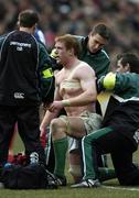 11 February 2006; Ireland's Paul O'Connell has his shoulder strapped up by team physio Cameron Steele, right and team doctor Dr. Gary O'Driscoll during the second half. RBS 6 Nations 2006, France v Ireland, Stade de France, Paris, France. Picture credit; Brendan Moran / SPORTSFILE
