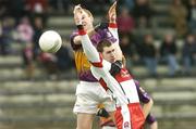 12 February 2006; Philip Wallace, Wexford, in action against Enda Muldoon, Derry. Allianz National Football League, Division 1B, Round 2, Wexford v Derry, Wexford Park, Wexford. Picture credit: Matt Browne / SPORTSFILE