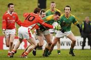 12 February 2006; Meath corner-back Caoimhin King , supported  by Anthony Moyles, is tackled by Charlie Veron and Steven McDonnell,  Armagh. Allianz National Football League, Division 1B, Round 2, Meath v Armagh, Pairc Tailteann, Navan, Co. Meath. Picture credit: Ray McManus / SPORTSFILE