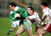 Presspics Sunday 12th February 2005 Fermanaghs James Sherry against Tyrones Ciaran Gourley and Conor Gormley ;Fermanagh V Tyrone Allianz National League at Brewester Park Enniskillen, Co Fermanagh .Picture Credit-Oliver Mc Veigh