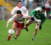 12 February 2006; Sean Cavanagh, Tyrone, in action against Raymond Johnston, Fermanagh. Allianz National Football League, Division 1A, Round 2, Fermanagh v Tyrone, Brewster Park, Enniskillen, Co. Fermanagh. Picture credit: Oliver McVeigh / SPORTSFILE