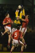 11 February 2006; Kerry's Darragh O Se supported by team-mate Kieran Donaghy, partially hidden, wins possession against Michael Shields, left, Noel O'Leary, 5, and Dermot Hurley, Cork. Allianz National Football League, Division 1A, Round 2, Cork v Kerry, Pairc Ui Rinn, Cork. Picture credit: Pat Murphy / SPORTSFILE