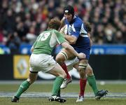 11 February 2006; Julien Bonnaire, France, is tackled by Gordon D'Arcy and Brian O'Driscoll (13), Ireland. RBS 6 Nations 2006, France v Ireland, Stade de France, Paris, France. Picture credit; Brendan Moran / SPORTSFILE