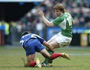 11 February 2006; Brian O'Driscoll, Ireland, attempts to avoid the tackle of David Marty, France. RBS 6 Nations 2006, France v Ireland, Stade de France, Paris, France. Picture credit; Brendan Moran / SPORTSFILE