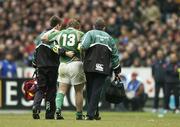 11 February 2006; Ireland captain Brian O'Driscoll leaves the pitch with a suspected tight hamstring, accompanied by team doctor Dr Gary O'Driscoll and physio Cameron Steele. RBS 6 Nations 2006, France v Ireland, Stade de France, Paris, France. Picture credit; Brendan Moran / SPORTSFILE