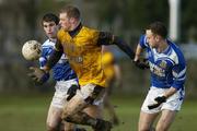 15 February 2006; Eoin Lennon, DCU, in action against Pat Kelly,right, and Batt Moriarty, Garda College. Datapac Sigerson Cup, Quarter-Final, Garda College v DCU, Garda College Sportsfield Complex, Templemore, Co. Tipperary. Picture credit: Matt Browne / SPORTSFILE