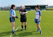 27 April 2014; Referee Gus Chapman performs the coin toss between Dublin captain Sinead Goldrick and Monaghan captain Christina Reilly. TESCO HomeGrown Ladies National Football League Division 1 Semi-Final, Dublin v Monaghan, Lannleire, Dunleer, Co. Louth. Picture credit: Brendan Moran / SPORTSFILE
