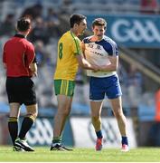 27 April 2014; Referee David Gough looks on as Donegal's Rory Kavanagh and Monaghan's Darren Hughes clash shortly before the Donegal player was sent off. Allianz Football League Division 2 Final, Donegal v Monaghan, Croke Park, Dublin. Picture credit: David Maher / SPORTSFILE