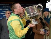 29 April 2014; Jockey Andrew Lynch with the Champion Steeplechase Trophy after victory in the Boylesports.com Champion Steeplechase on Sizing Europe. Punchestown Racecourse, Punchestown, Co. Kildare. Picture credit: Matt Browne / SPORTSFILE