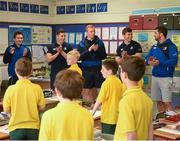 30 April 2014; Leinster Rugby stars, from left, Eoin Reddan, Noel Reid, Darragh Fanning, Brendan Macken and Rob Kearney were on hand at St Patrick’s Boys National School, Hollypark, Blackrock in Dublin today to help out with a surprise training session for some of the school children to mark the launch of The Herald Leinster Rugby Summer Camps which run in venues across the province throughout July and August. Launch of the Leinster Rugby Summer Camps, St. Patrick’s Boys National School, Hollypark, Blackrock, Dublin. Picture credit: Stephen McCarthy / SPORTSFILE
