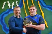 1 May 2014; Bank of Ireland Leinster Player of the Month for February / March Tadhg Furlong receives his award from Paddy Power. Tadhg was voted as the winner by Leinster supporters on Twitter from a shortlist selected by the Leinster team management which also included Darragh Fanning and Noel Reid. Voting for the April award, between Jamie Heaslip, Noel Reid and Cian Healy, is now open via @bankofireland twitter using #boirugby. Paddy Power said, &quot;Our partnership with Bank Of Ireland @ Work quite simply makes our employees’ lives easier.  Their onsite presence and dedicated website helps make Paddy Power a great place to work!&quot;. Leinster Rugby HQ, UCD, Belfield, Dublin. Picture credit: Stephen McCarthy / SPORTSFILE