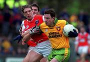 6 June 1999; Adrian Sweeney of Donegal in action against Kieran McGeeney of Armagh during the Bank of Ireland Ulster Senior Football Championship quarter-final match between Donegal and Armagh at MacCumhail Park in Ballybofey, Donegal. Photo by Ray Lohan/Sportsfile
