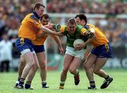 30 May 1999; Brendan Guckian of Leitrim in action against Roscommon players, from left, Eddie Lohan, Fergal O'Donnell and Ciaran Heneghan during the Bank of Ireland Connacht Senior Football Championship quarter-final match between Leitrim and Roscommon at Páirc Seán Mac Diarmada in Carrick-on-Shannon, Leitrim. Photo by Brendan Moran/Sportsfile