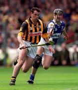20 June 1999; Brian McEvoy of Kilkenny is tackled by Paul Cuddy of Laois during the Guinness Leinster Senior Hurling Championship semi-final match between Kilkenny and Laois at Croke Park in Dublin. Photo by Ray McManus/Sportsfile