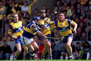 6 June 1999; Colin Lynch of Tipperary in action against Brian Quinn, supported by his Clare team-mates Liam Doyle, left, and Sean McMahon, centre, during the Guinness Munster Senior Hurling Championship semi-final match between Clare and Tipperary at Páirc Uí Chaoimh in Cork. Photo by Ray McManus/Sportsfile
