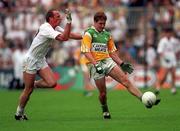 13 June 1999; Colm Quinn of Offaly in action against Willie McCreery of Kildare during the Bank of Ireland Leinster Senior Football Championship quarter-final match between Kildare and Offaly at Croke Park in Dublin. Photo by Damien Eagers/Sportsfile