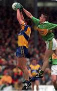 20 June 1999; Brendan Rouine of Clare in action against Darragh Ó Sé of Kerry during the Bank of Ireland Munster Senior Football Championship semi-final match between Kerry and Clare at Fitzgerald Stadium in Killarney, Kerry. Photo by Brendan Moran/Sportsfile