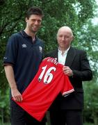 28 May 1999; A benefit night for former Irish International soccer star Dave Langan, who is now registered as disabled in the UK as a result of injuries picked up while playing for the Republic of Ireland, will be held at Cherry Orchard Football Club in Ballyfermot, Dublin on Monday, June 14th. Pictured are Republic of Ireland captain Niall Quinn, left, and Dave Langan with a Manchester United Shirt signed by Roy Keane. Photo by Brendan Moran/Sportsfile
