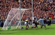 6 June 1999; Tipperary goalkeeper Brendan Cummins, and his defenders Fergal Heaney, left, and Liam Sheedy, fail to stop a last minute penalty by Davy Fitzgerald of Clare, which resulted in a drawn game, during the Guinness Munster Senior Hurling Championship semi-final match between Clare and Tipperary at Páirc Uí Chaoimh in Cork. Photo by Ray McManus/Sportsfile
