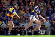 6 June 1999; Eddie Enright of Tipperary in action against Sean McMahon of Clare during the Guinness Munster Senior Hurling Championship semi-final match between Clare and Tipperary at Páirc Uí Chaoimh in Cork. Photo by Ray McManus/Sportsfile