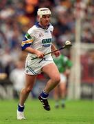 30 May 1999; Fergal Hartley of Waterford runs with one boot during the Guinness Munster Senior Hurling Championship quarter-final match between Limerick and Waterford at Páirc Uí Chaoimh in Cork. Photo by Ray McManus/Sportsfile