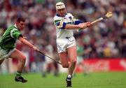30 May 1999; Fergal Hartley of Waterford in action against Ciaran Carey of Limerick during the Guinness Munster Senior Hurling Championship quarter-final match between Limerick and Waterford at Páirc Uí Chaoimh in Cork. Photo by Ray McManus/Sportsfile