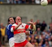 20 June 1999; Geoffrey McGonagle of Derry in action against Gavin Hartin of Cavan during the Bank of Ireland Ulster Senior Football Championship quarter-final match between Derry and Cavan at Casement Park in Belfast. Photo by David Maher/Sportsfile
