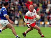 20 June 1999; Geoffrey McGonagle of Derry in action against Gavin Hartin of Cavan during the Bank of Ireland Ulster Senior Football Championship quarter-final match between Derry and Cavan at Casement Park in Belfast. Photo by David Maher/Sportsfile