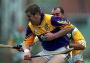 20 June 1999; Ger Cush of Wexford in action against Johnny Dooley of Offaly during the Guinness Leinster Senior Hurling Championship semi-final match between Offaly and Wexford at Croke Park in Dublin. Photo by Ray McManus/Sportsfile