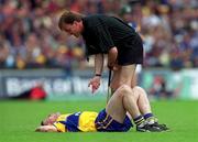 6 June 1999; Referee Dickie Murphy attends to Jamesie O'Connor of Clare during the Guinness Munster Senior Hurling Championship semi-final match between Clare and Tipperary at Páirc Uí Chaoimh in Cork. Photo by Ray McManus/Sportsfile