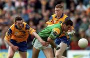 30 May 1999; Jason Ward of Leitrim in action against Clifford McDonald, left, and Enon Gavin of Roscommon during the Bank of Ireland Connacht Senior Football Championship quarter-final match between Leitrim and Roscommon at Páirc Seán Mac Diarmada in Carrick-on-Shannon, Leitrim. Photo by Brendan Moran/Sportsfile