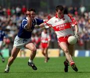 20 June 1999; Joe Brolly of Derry in action against Peter Reilly of Cavan during the Bank of Ireland Ulster Senior Football Championship quarter-final match between Cavan and Derry at Breffni Park in Cavan. Photo by Damien Eagers/Sportsfile
