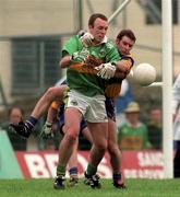 20 June 1999; John Crowley of Kerry in action against Barry Keating of Clare during the Bank of Ireland Munster Senior Football Championship semi-final match between Kerry and Clare at Fitzgerald Stadium in Killarney, Kerry. Photo by Brendan Moran/Sportsfile